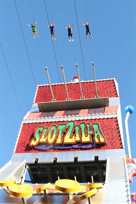 Slotzilla zipline las vegas photos - SlotZilla is a zip line attraction at Fremont Street Experience in downtown Las Vegas. SlotZilla, shaped like a giant slot machine, has two take-off levels. Riders take a thrilling ride down Fremont Street under the massive Viva Vision video screen, with free nightly shows. Las Vegas, United States. Suggest edits to improve what we show.